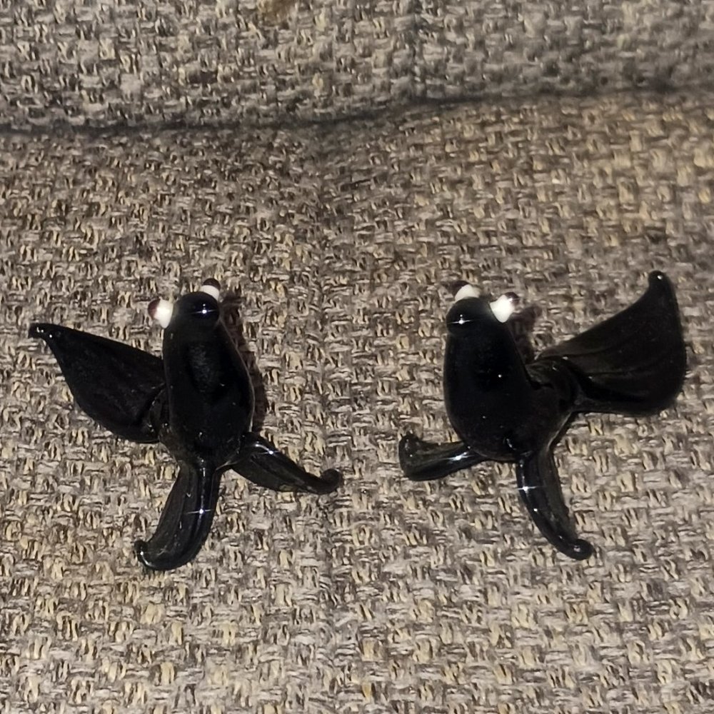 A Pair of Vintage Black Glass Miniature Seal Figurines